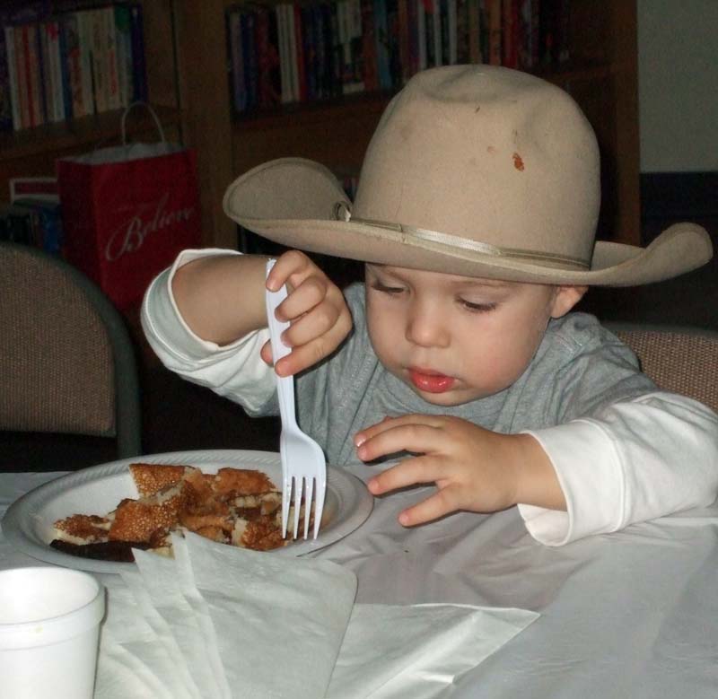 photo of boy eating breakfast